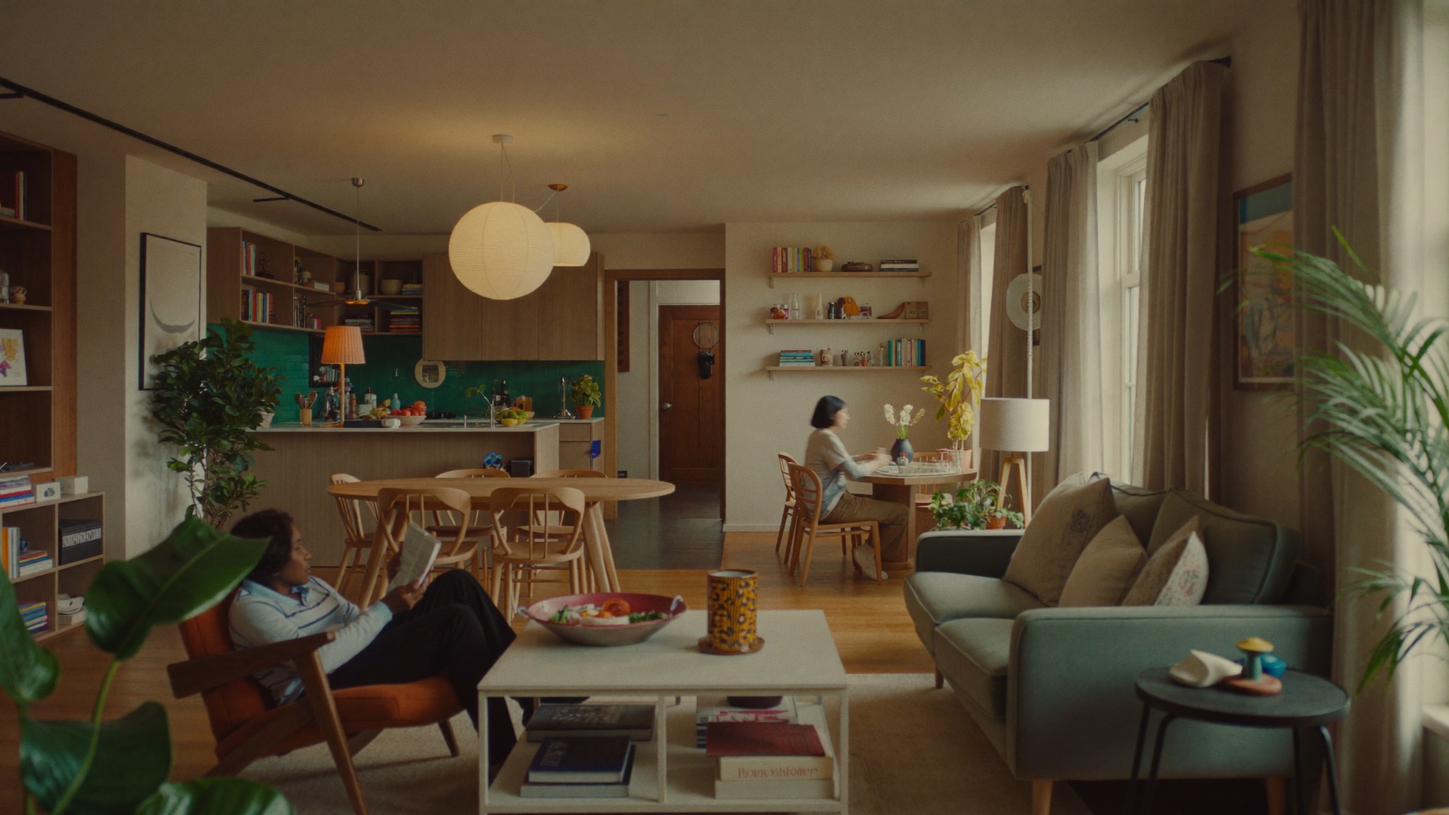 Housemates sharing a bright, well-kept common area in a Be Nice co-living home