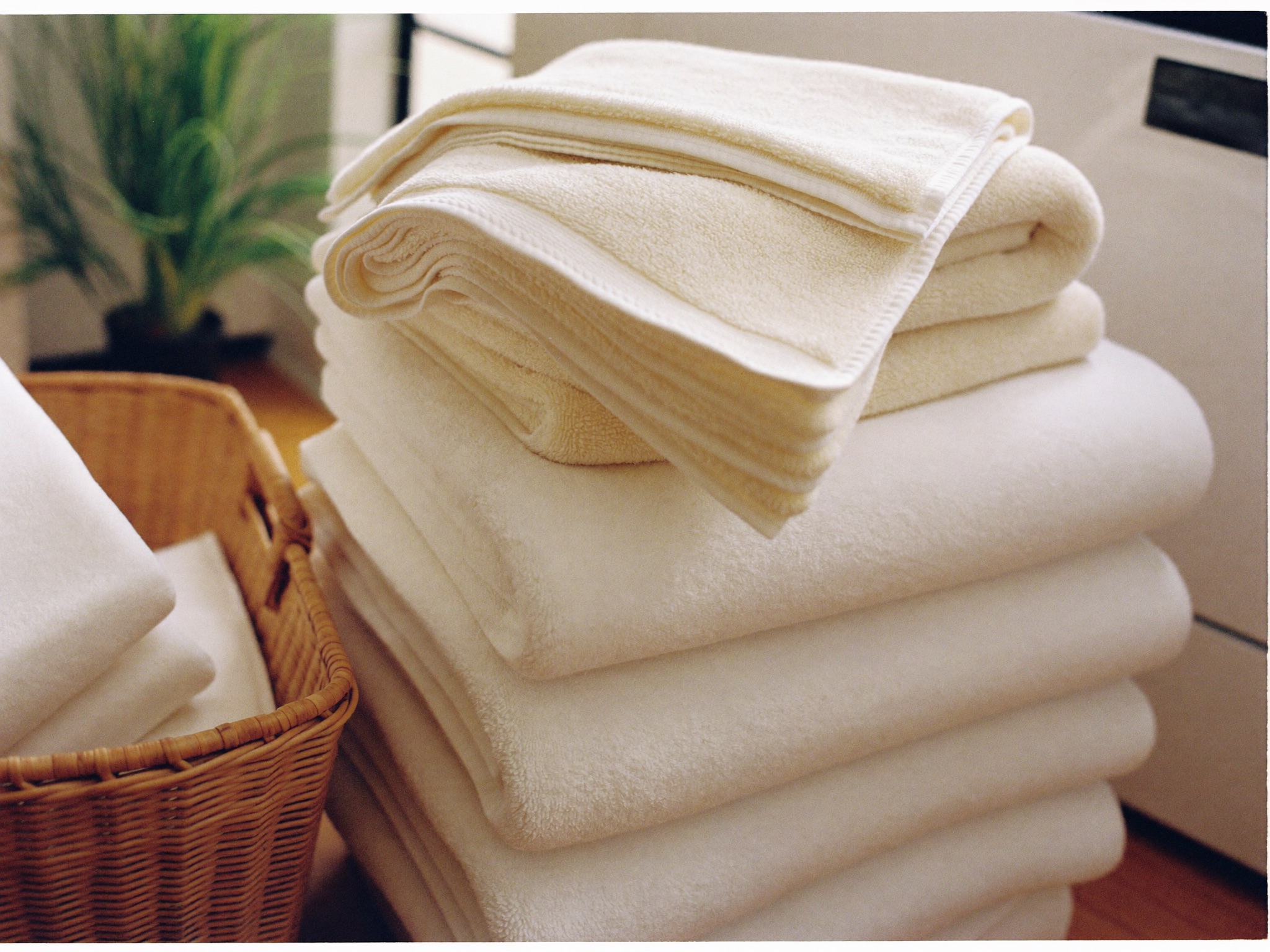 In-home washer and dryer with folded towels stacked alongside