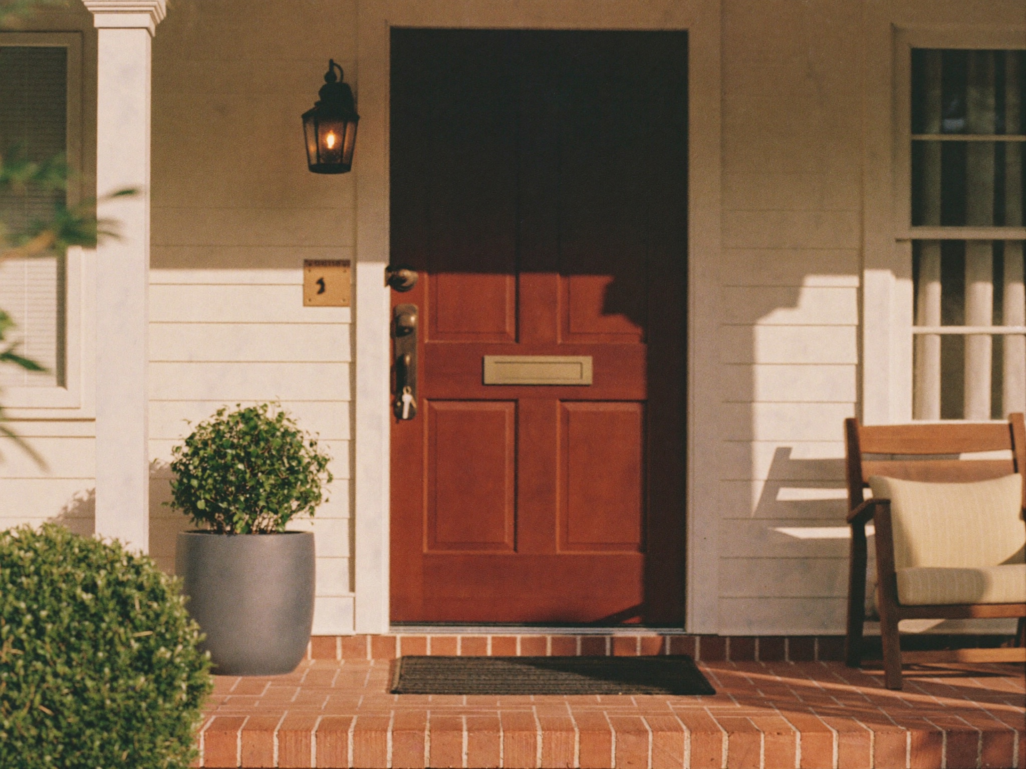 Front door and porch of a well-kept Be Nice co-living home